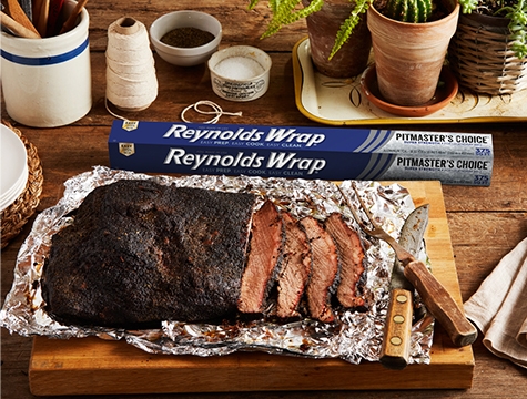 Sliced Brisket On Foil With Carving Set