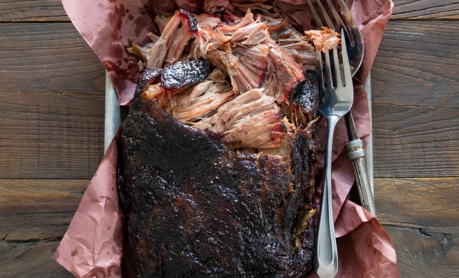 Grilled meat wrapped on pink paper